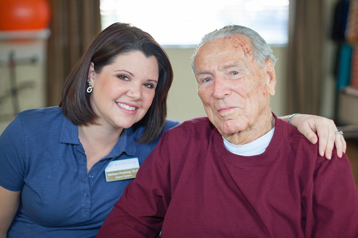 A caregiver with a resident at Roseville Care Center