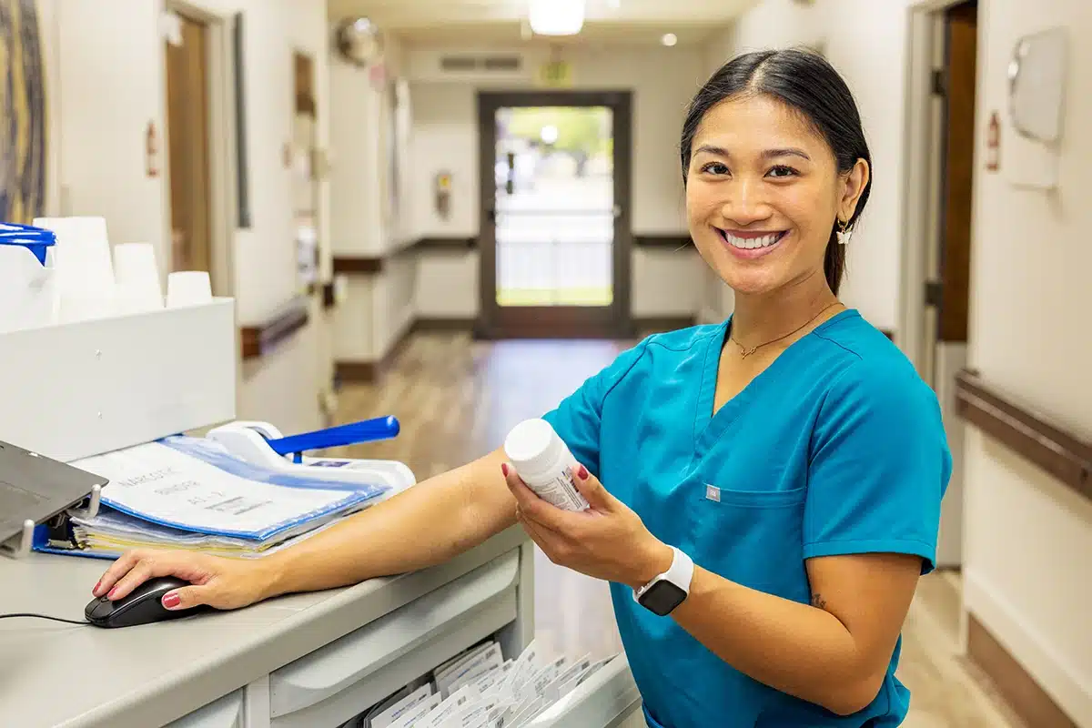A nurse at a nurse's cart at Roseville Care Center
