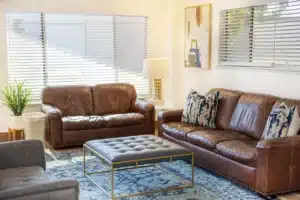 common living room with soft sofas at Roseville Care Center
